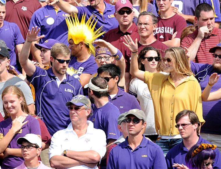 LSU fans dance amid Aggies fans Saturday, Oct. 20, 2012 during the Tigers' game against Texas A&amp;M in College Station.
 