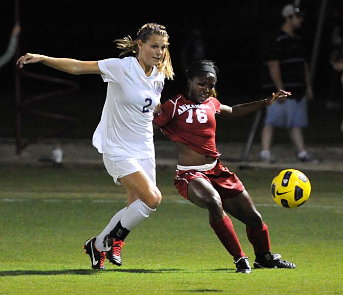 LSU junior forward Addie Eggleston battles for the ball with an Arkansas defender Thursday, Oct. 25, 2012 during the Tigers' match against Arkansas in the LSU Soccer Stadium.
 