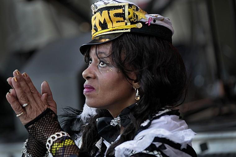 In this Oct. 11, 2012 photo, Cinnamon Black, a Treme Baby Doll, performs with the Treme Brass band at an evening concert in Armstrong Park in the Treme section of New Orleans. The historic New Orleans neighborhood where immigrants, free people of color and slaves were allowed to own property, worship on Sundays and gather in public to dance and play music, has hit a milestone. It was roughly 200 years ago that cottages were built and a community established just beyond the French Quarter in the area named for French milliner and property owner, Claude Treme. The neighborhood is considered one of America's most unique, and it is getting a new lease on life thanks, in part, to the spotlight provided by HBO's series, &#8220;Treme.&#8221; It's also at the center of a $4 billion redevelopment plan. (AP Photo/Gerald Herbert)
 