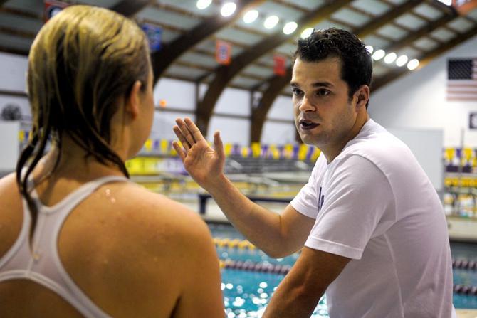 LSU diving graduate assistant Eric Sehn, right, talks to the one of the divers Tuesday, Oct. 16, 2012, during practice in the Natatorium.
 