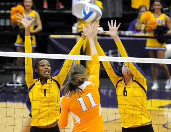 LSU freshman middle blocker Khourtni Fears (1) and senior outside hitter Maddie Jones (6) try to block a Tennessee spike during a game against the Volunteers on October 10, 2012.
 