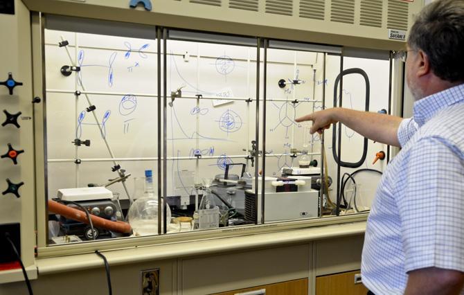 Dr. George Stanley Ph.D of LSU's Department of Chemistry shows current graduate research inside a fume hood located in the new Choppin Hall Annex building.
 