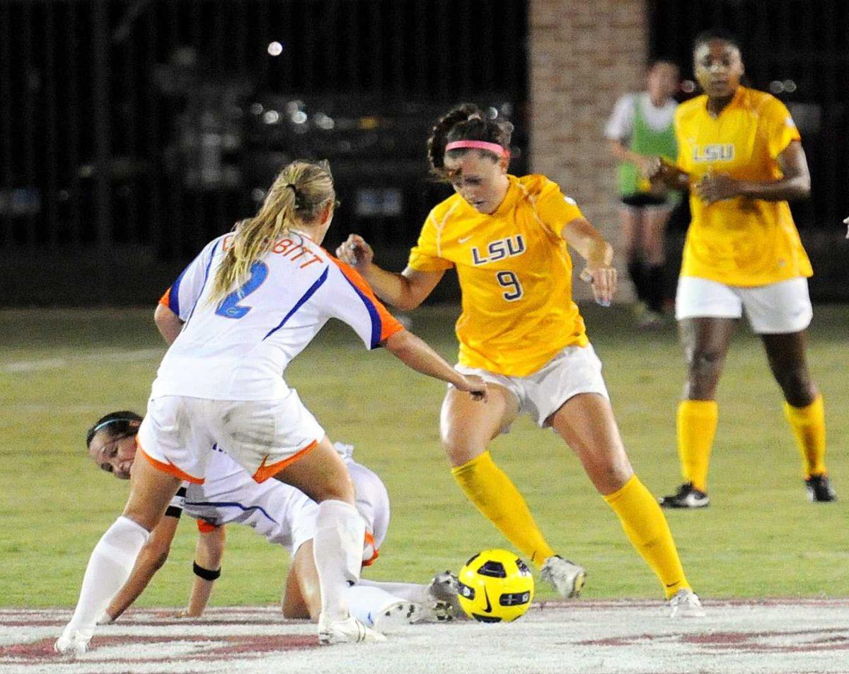 Freshman forward Jade Kovacevic, 9, dribbles passed two University of Florida senior defenders Friday, Oct. 5, 2012 at the LSU Soccer Stadium. The Gators defeated the Tigers 2-0.