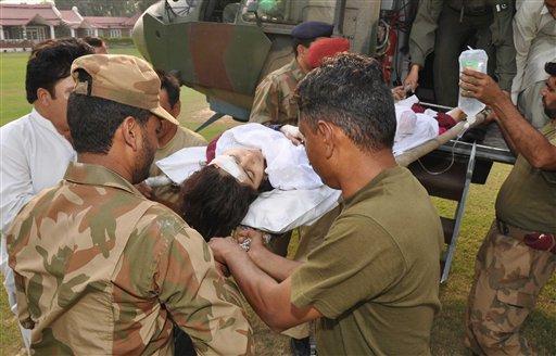 In this photo released by Inter Services Public Relations department, Pakistani soldiers carry wounded Pakistani girl, Malala Yousufzai, from a military helicopter to a military hospital in Peshawar, Pakistan. A Taliban gunman walked up to a bus taking children home from school in Pakistan&#8217;s volatile Swat Valley Tuesday and shot and wounded the 14-year-old activist known for championing the education of girls and publicizing atrocities committed by the Taliban, officials said. (AP Photo/Inter Services Public Relations Department)
 