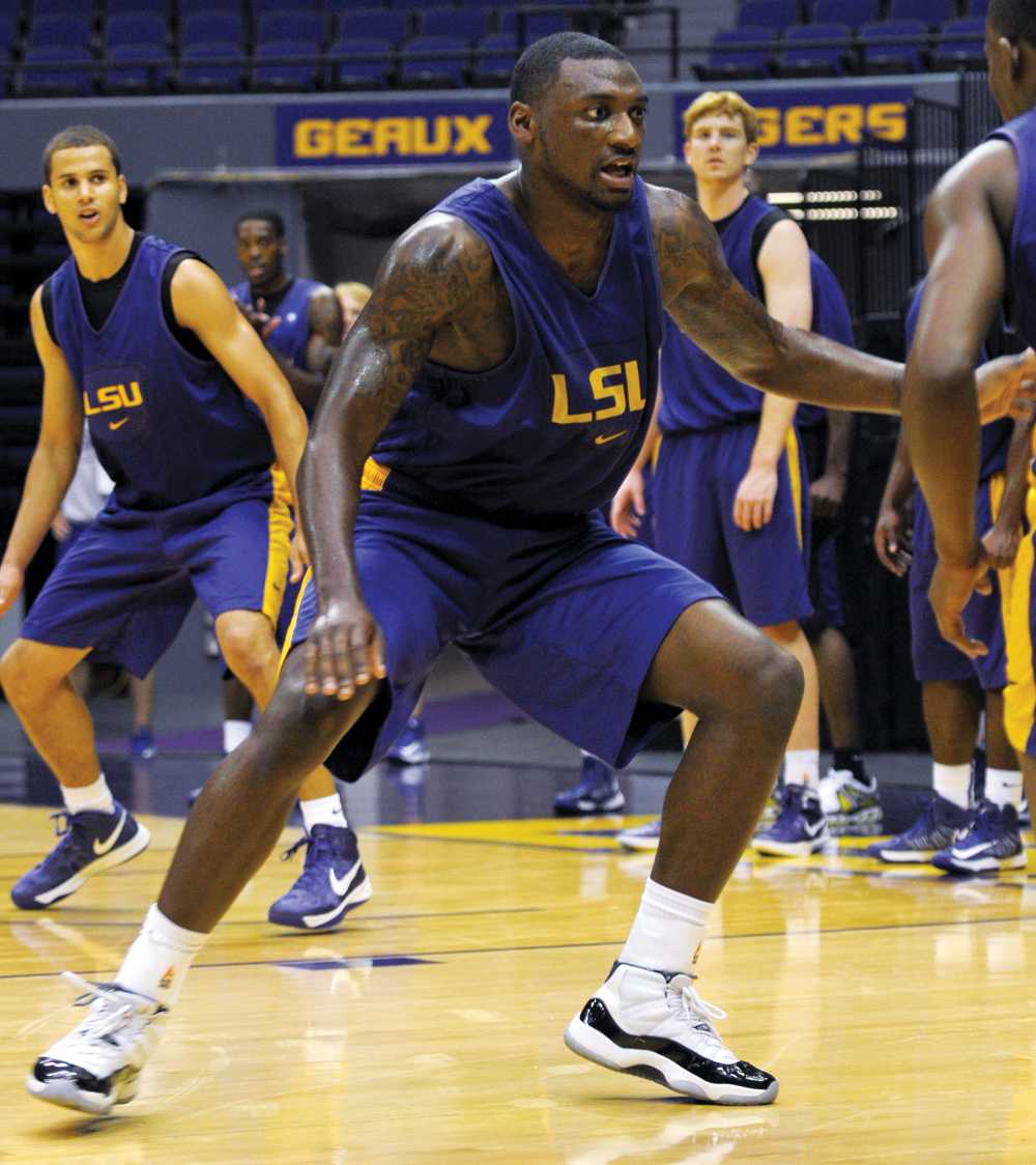 LSU junior forward Jalen Courtney (14) defends a player Friday, Oct. 12, 2012, during the men's basketball team's first practice of the season in the PMAC.