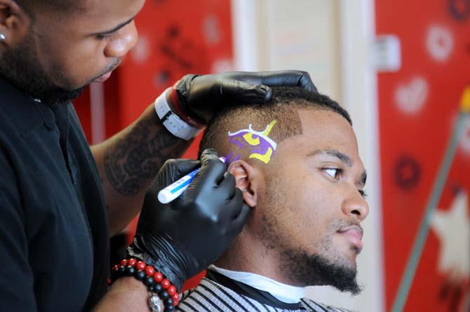 Local barber cuts, paints elaborate designs in hair