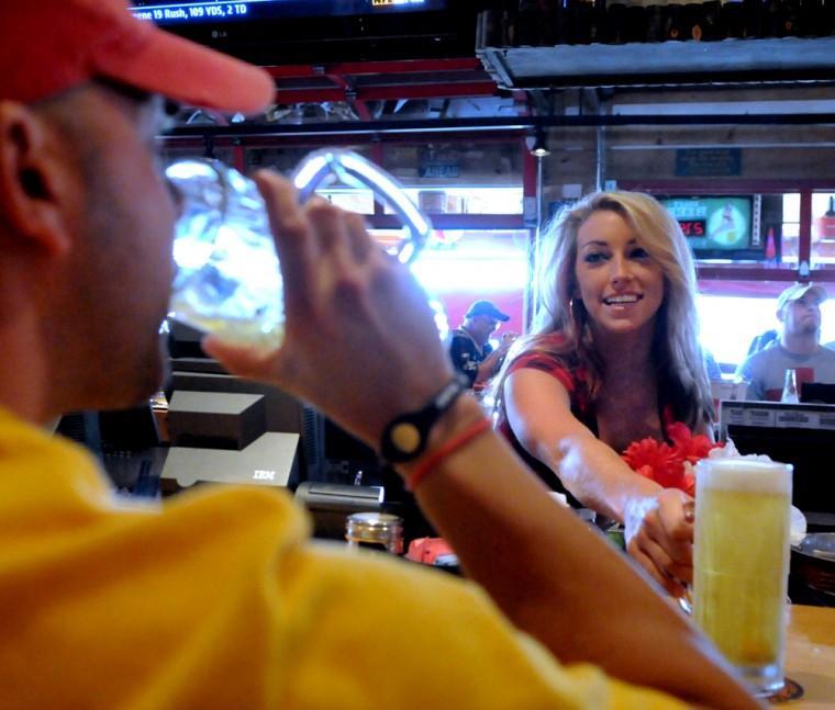 LSU kinesiology major Taylor Faulk serves on Sunday, Oct. 14, 2012 at Twin Peaks a beer to customer.
 