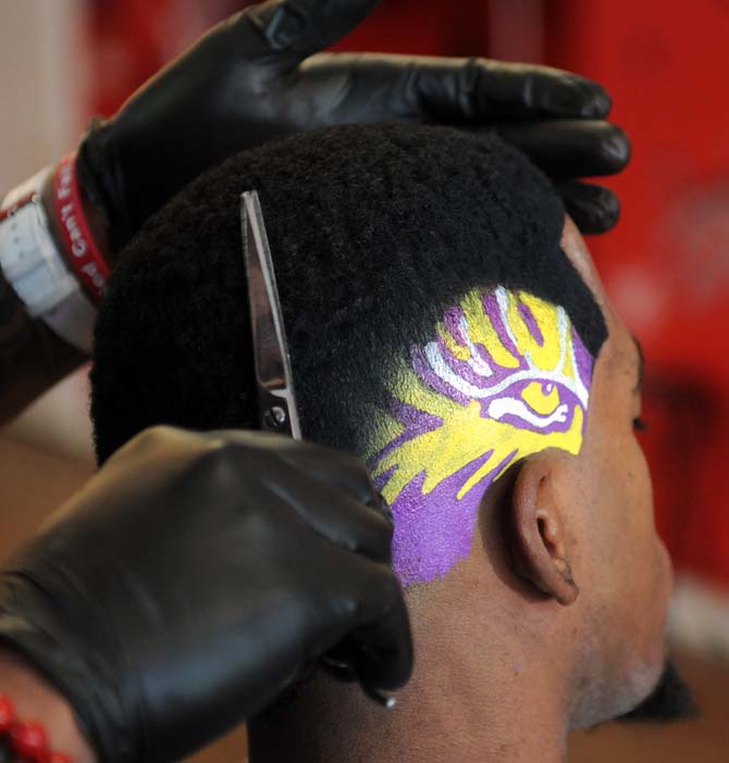 Local barber cuts, paints elaborate designs in hair