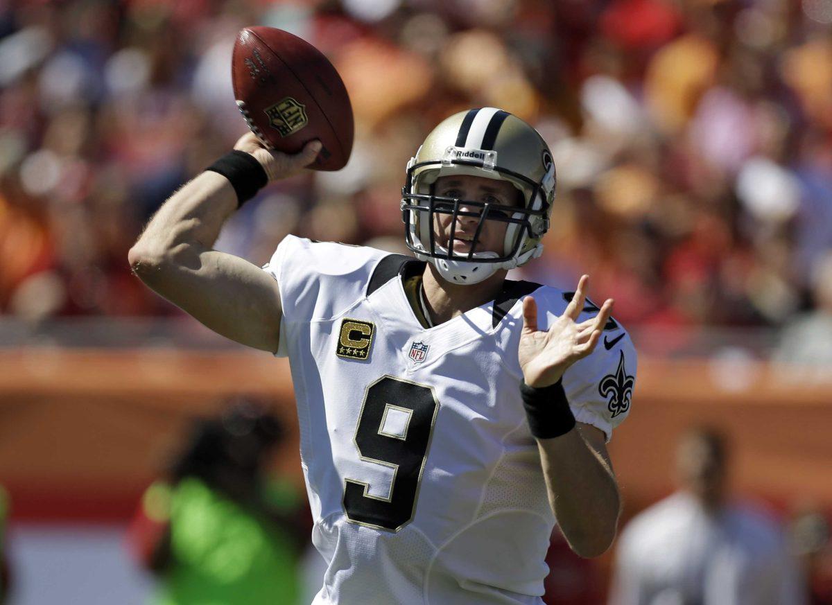 New Orleans Saints quarterback Drew Brees (9) throws a pass during the first quarter of an NFL football game Sunday, Oct. 21, 2012, in Tampa, Fla. (AP Photo/Chris O'Meara)