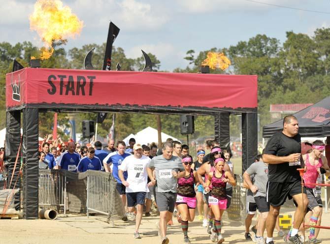 Runners face fire, mud and walls in 5k Warrior Dash