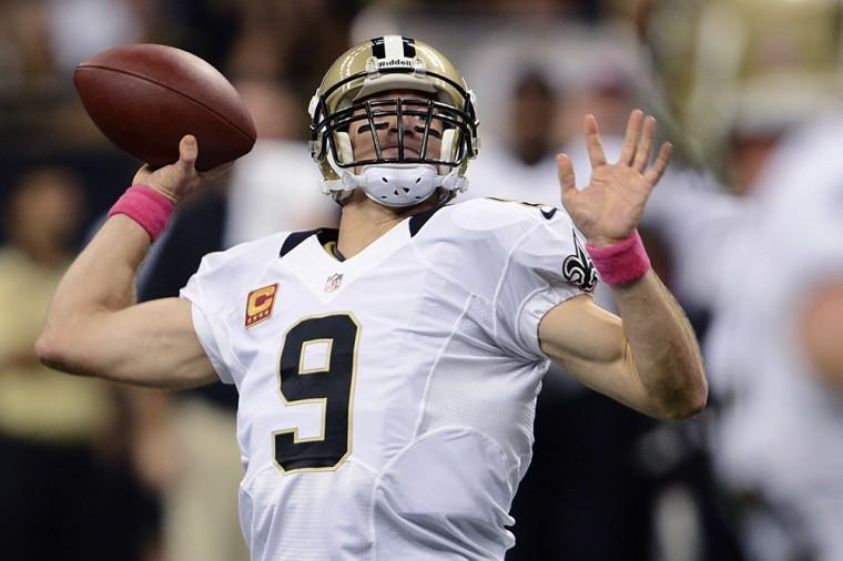 New Orleans Saints quarterback Drew Brees (9) throws a touchdown pass for his 48th consecutive game, breaking Johnny Unitas' NFL record which stood for over 50 years, during an NFL football game against the San Diego Chargers at Mercedes-Benz Superdome in New Orleans, Sunday, Oct. 7, 2012. (AP Photo/Bill Feig)
 