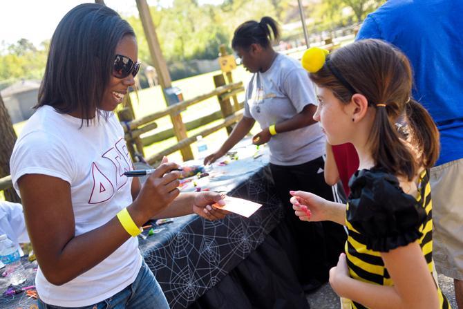 National Pan-Hellenic Council members work at Boo at the Zoo