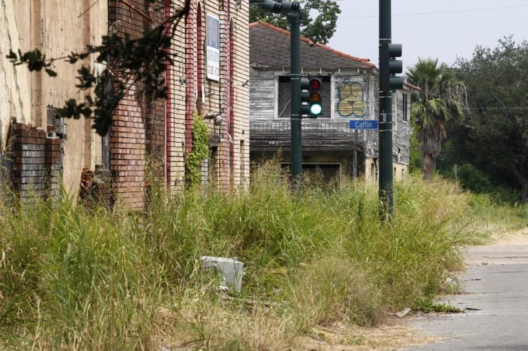 FILE PHOTO - In this Aug. 25, 2011 file photo, destroyed buildings and overgrown weeds are seen from Flood St. looking towards Caffin St. in the Lower 9th Ward section of New Orleans. Residents and the City of New Orleans may be pushing back against tour companies ushering out-of-towners into to the Lower 9th Ward, the neighborhood made famous when floodwalls and levees failed in 2005, pushing homes off their foundations and stranding residents on rooftops. (AP Photo/Gerald Herbert, file)
 