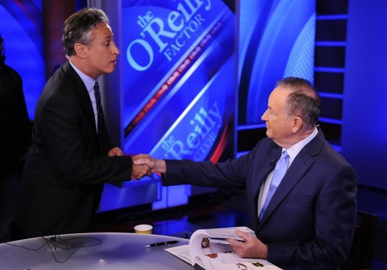 FILE - In this Sept. 22, 2010 file photo, Comedy Central's Jon Stewart, left, and Bill O'Reilly tape an interview in New York. Stewart and O'Reilly, a celebrity odd couple with a history of public political feuds, tangle in a sold-out debate in Washington. The so-called "Rumble in the Air-Conditioned Auditorium" offers a jocular sideshow to the series of three more somber debates this month between President Barack Obama and Republican Mitt Romney. (AP Photo/Peter Kramer)
 