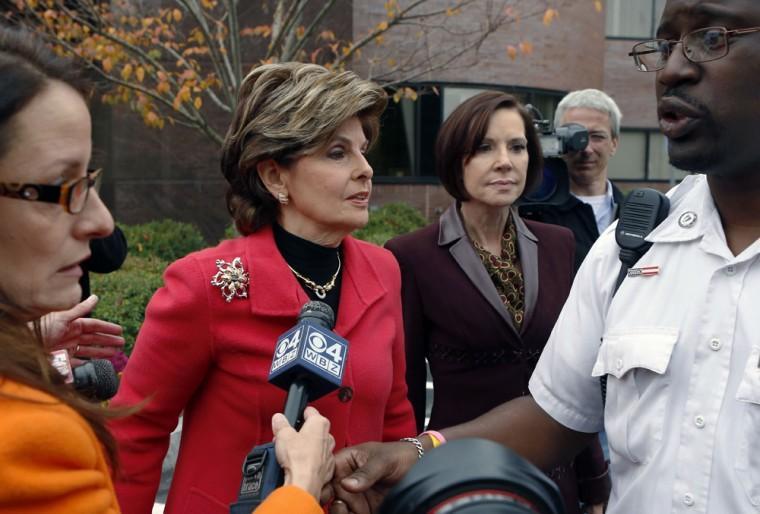 Maureen Stemberg Sullivan, second right, ex-wife of Staples founder Tom Stemberg, and her lawyer Gloria Allred, second left, leave Norfolk County Probate Court on Wednesday, Oct. 24, 2012, in Canton, Mass., after a hearing where they said they didn't object to a Boston Globe motion to lift an impoundment order on GOP presidential candidate Mitt Romney's testimony in the case from the early 1990s. A Massachusetts probate judge will hold another hearing before deciding whether to unseal testimony that Gov. Romney gave in the divorce case of Staples founder Tom Stemberg. Staples was founded with backing from Romney's firm, Bain Capital. (AP Photo/Bizuayehu Tesfaye)
 