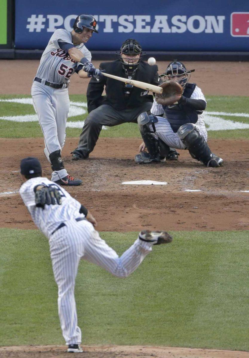 Detroit Tigers' Quintin Berry hits a ground rule double off New York Yankees' pitcher Hiroki Kuroda in the seventh inning of Game 2 of the American League championship series Sunday, Oct. 14, 2012, in New York. (AP Photo/Charlie Riedel)