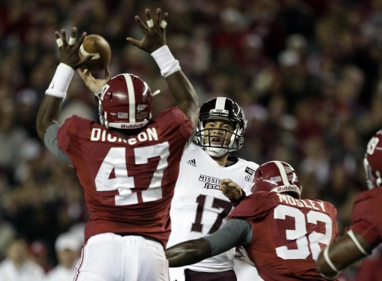 Mississippi State quarterback Tyler Russell (17) throws as he is rushed by Alabama linebacker Xzavier Dickson (47) and linebacker C.J. Mosley (32) during the first half of an NCAA college football game at Bryant-Denny Stadium in Tuscaloosa, Ala., Saturday, Oct. 27, 2012. (AP Photo/Dave Martin)
 