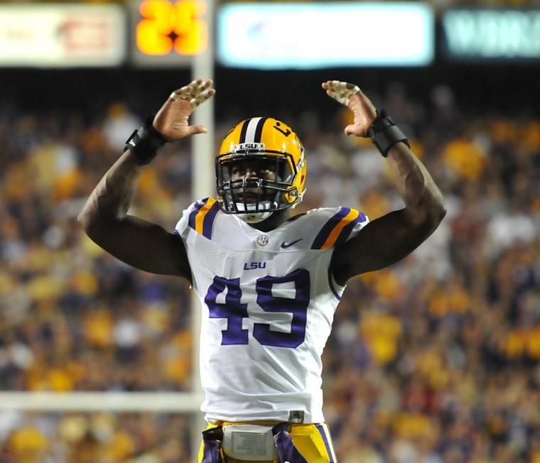 LSU junior defensive end Barkevious Mingo (49) amps up the crowd Saturday, Nov. 3, 2012 during the Tigers' 21-17 loss against Alabama in Tiger Stadium.
 