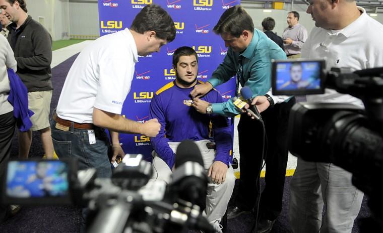 LSU sophomore fullback Connor Neighbors, from Huntsville, Ala., is the center of media attention Tuesday during player interviews in the Indoor Practice Facility.
 