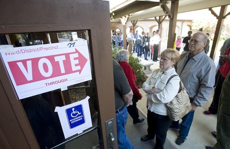 Eve and Charles Clayton wait patiently in line to vote at Holy Trinity Lutheran Church in Shreveport, La., Tuesday, Nov. 6, 2012. Lines at the church were long but moved quickly. (AP Photo/The Shreveport Times, Douglas Collier)
 