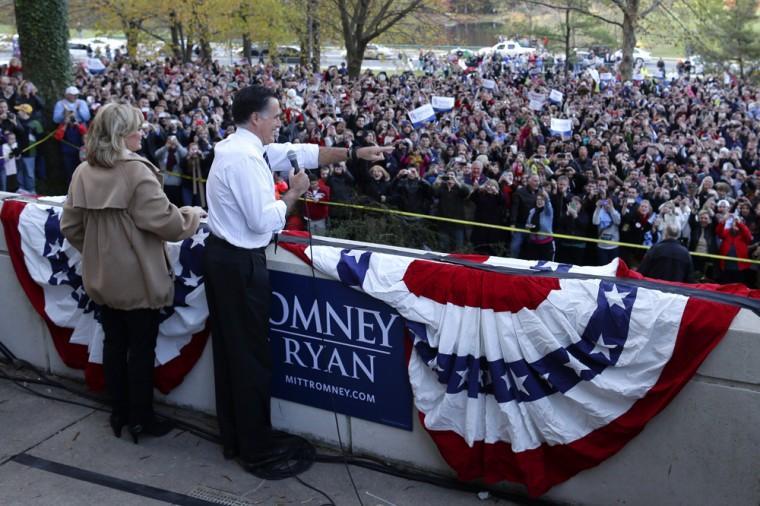 Republican presidential candidate, former Massachusetts Gov. Mitt Romney, accompanied by his wife Ann, speaks to an overflow crowd at a Virginia campaign rally at The Patriot Center, George Mason University, in Fairfax, Va., Monday, Nov. 5, 2012. (AP Photo/Charles Dharapak)
 