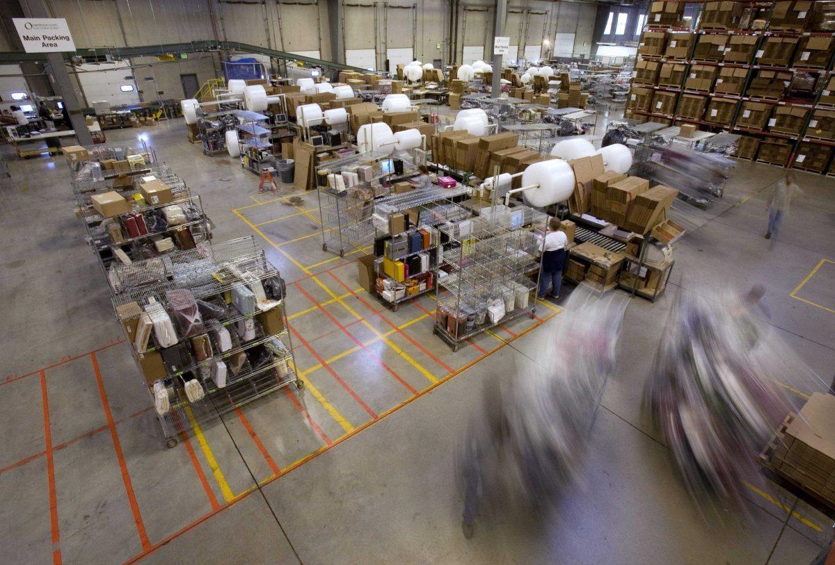 FILE - In this Friday, Nov. 29, 2008, file photo, carts full of merchandise ordered online are rolled to the main packing area for shipping at the Overstock.com warehouse, in Salt Lake City. Cyber Monday, coined in 2005 by a shopping trade group that noticed a spike in online sales on the Monday after Thanksgiving when people returned to their work computers, is the next in a line of days that stores are counting on to jumpstart the holiday shopping season. This year it is expected to be the biggest online shopping day of the year for the third year in a row. (AP Photo/Douglas C. Pizac)