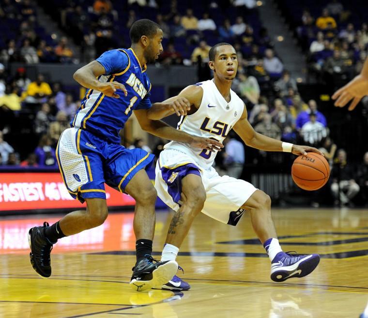 LSU senior guard Charles Carmouche (0) dribbles the ball Friday, Nov. 9, 2012 during the Tigers' 77-63 win against UC-Santa Barbara in the PMAC.
 