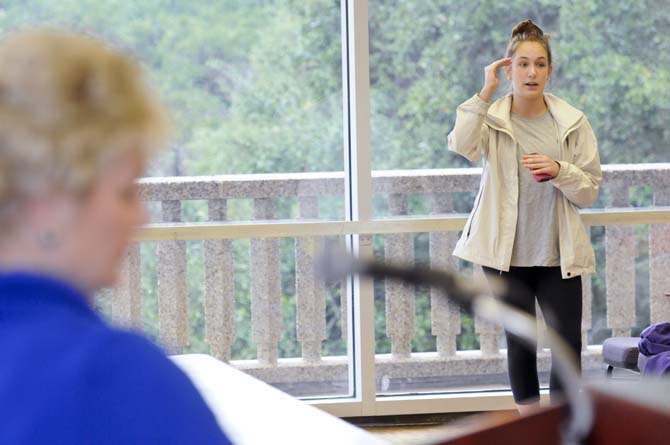 Sociology junior Claire Strickland (right) runs through a list of concerns she had for how the bomb threat was handled as Executive Assistant to the Chancellor and Head of the EOC, D'Ann Morris (left), listens and later addresses Strickland's concerns at an EOC discussion panel Tuesday, Nov. 27, 2012 in the Atchafalaya Room in the Union.
 