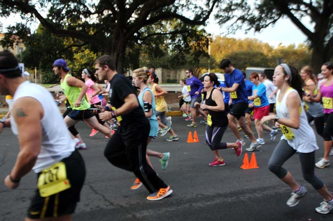 Runners take off Sunday evening down Dalrymple Drive for RUNapalooza, a 5K to promote hunger awareness in the LSU and Baton Rouge community.
 