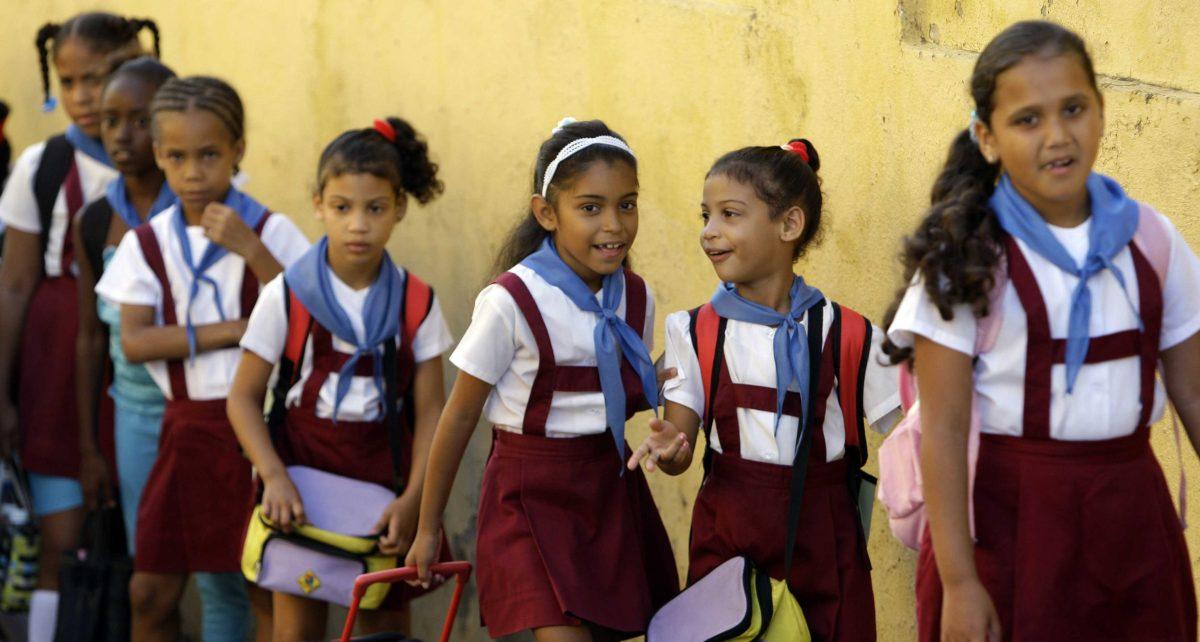 School girls line up for the start of classes in Santiago de Cuba, Cuba, Monday, Nov. 5, 2012. Classes resumed Monday in a sign of some return to normalcy after the passing of Hurricane Sandy, but more than 100 schools remain shuttered due to storm damage. (AP Photo/Ismael Francisco, Cubadebate)