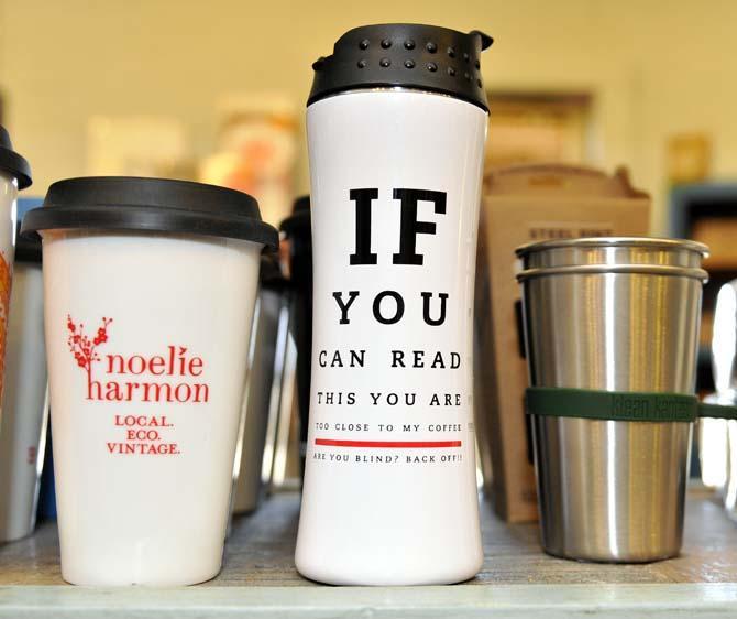 Cups and thermoses rest on a shelf in local boutique Noelie Harmon, located on Hollydale Avenue.
 