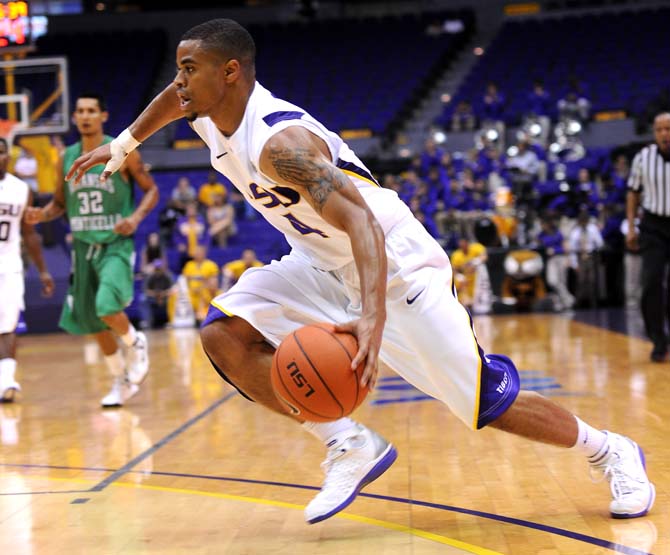 LSU freshman guard Corban Collins (4) makes a lunge toward the goalpost during the Tigers' 82-66 victory over the Boll Weevils Monday Nov. 5, 2012 in the PMAC.
 