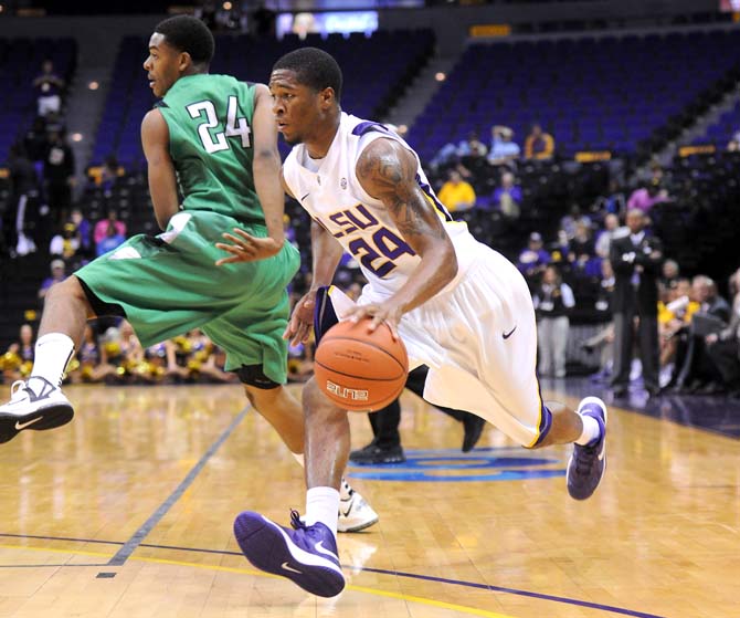 LSU freshman guard Malik Morgan (24) maneuvers past Arkansas-Monticello junior forward Amir Royal (24) during the Tigers' 82-66 victory over the Boll Weevils Monday Nov. 5, 2012 in the PMAC.
 