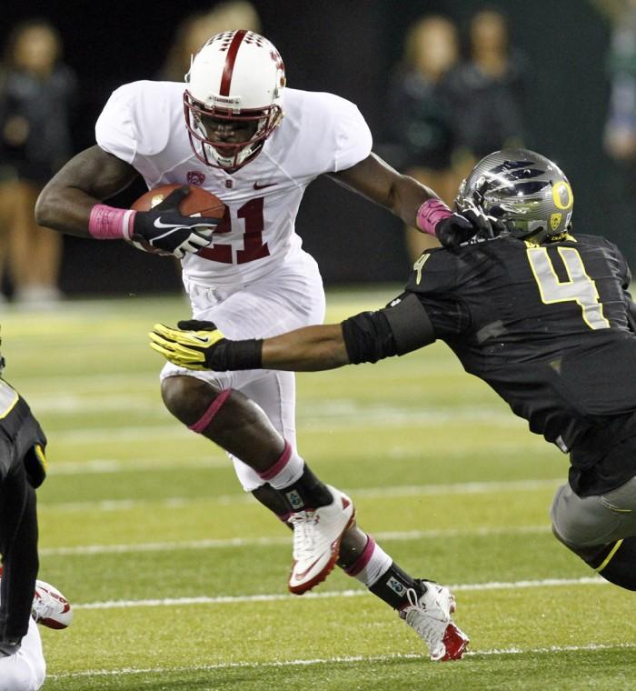 Stanford receiver Jamal-Rashad Patterson, left, tries to elude Oregon defender Erick Dargan during the first half of their NCAA college football game in Eugene, Ore., Saturday, Nov. 17, 2012.(AP Photo/Don Ryan)
 