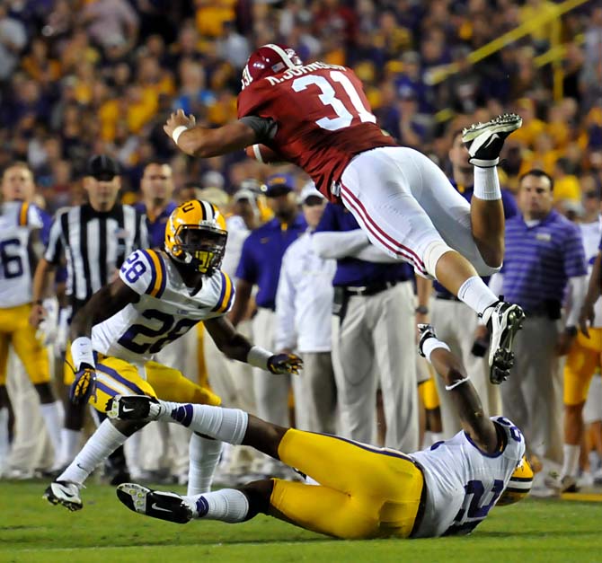 Alabama tight end Kelly Johnson is upturned while running the ball Saturday, Nov. 3, 2012 during the Tigers' 21-17 loss against Alabama in Tiger Stadium.
 