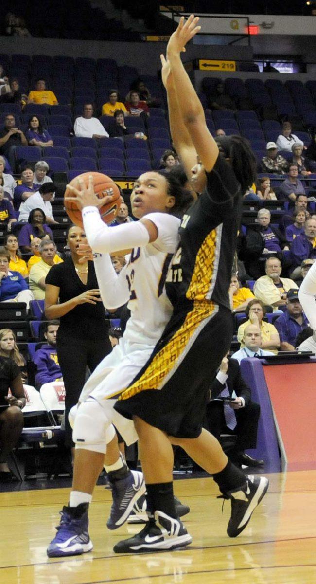 LSU freshman guard Danielle Ballard (32) tries to shoot around a Wichita State defender during the Lady Tiger's 72-70 win over the Shockers on November 11, 2012.