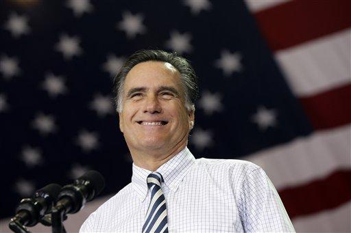 Republican presidential candidate and former Massachusetts Gov. Mitt Romney smiles as he campaigns at the International Exposition Center in Cleveland, Sunday, Nov. 4, 2012. (AP Photo/Charles Dharapak)
 