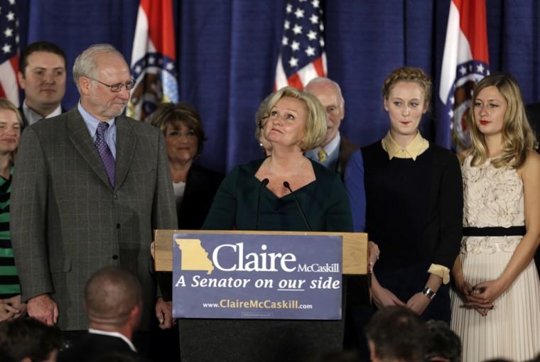 Flanked by family members, Sen. Claire McCaskill, D-Mo., looks up as she talks about her mother, Betty Anne McCaskill, who recently passed away, while declaring victory over challenger Rep. Todd Akin, R-Mo., in the Missouri Senate race Tuesday, Nov. 6, 2012, in St. Louis. (AP Photo/Jeff Roberson)
 