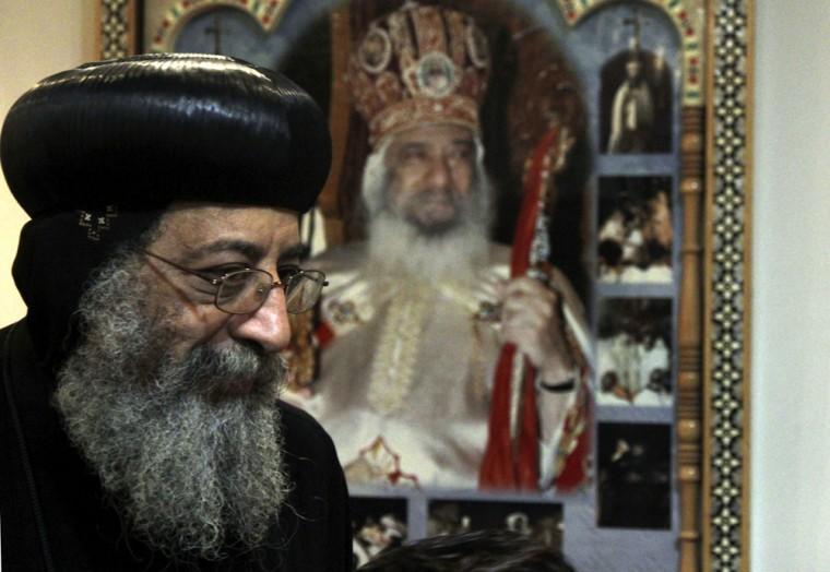 Bishop Tawadros, 60, soon to be Pope Tawadros II greets well-wishers, not shown, after being named the 118th Coptic Pope in the Wadi Natrun Monastery complex northwest of Cairo, Egypt, Sunday, Nov. 4, 2012. Egypt's ancient Coptic Christian church named a new pope on Sunday, Nov. 4, 2012 to spiritually guide the community through a time when many fear for their future with the rise of Islamists to power and deterioration in police powers after last year's uprising. (AP Photo/Roger Anis, El Shorouk Newspaper) EGYPT OUT
 