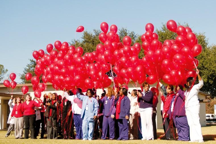 Employees of the LSU Mid City Clinic prepare to release bouquets of red ballons in honor of World AIDS Day on Dec. 1, 2011. This year, the University is holding the event on Dec. 5.
 