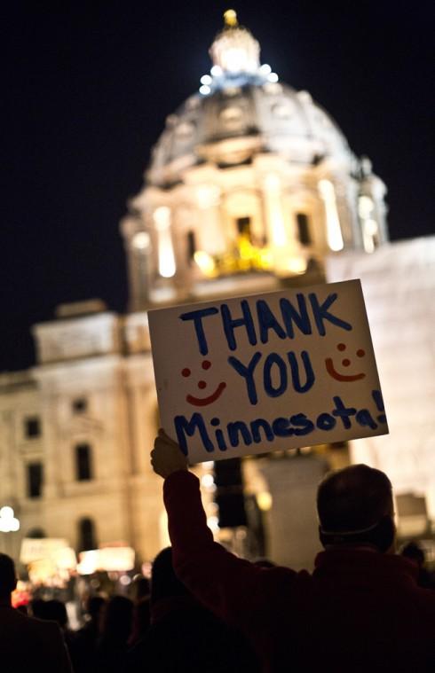 Brad Weber of Eden Prairie holds up a sign thanking people for voting no, as opponents of an unsuccessful ballot effort to define marriage as between a man and a woman rally outside the State Capitol in St. Paul, Minn., on Wednesday, Nov. 7, 2012. (AP Photo/The Star Tribune, Renee Jones Schneider)
 