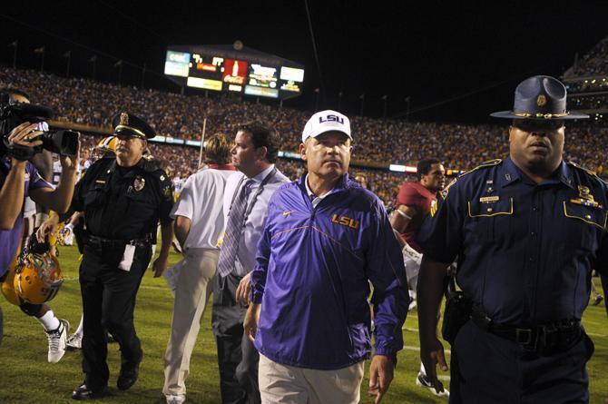 LSU coach Les Miles walks off the field after the Tigers' 21-17 loss to Alabama in Tiger Stadium.
 