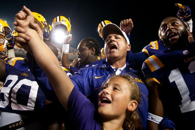 LSU Coach Les Miles, his daughter Macy Grace, and the football team sing the alma mater following the team's 63-14 victory against Idaho on Sept. 15, 2012, in Tiger Stadium.