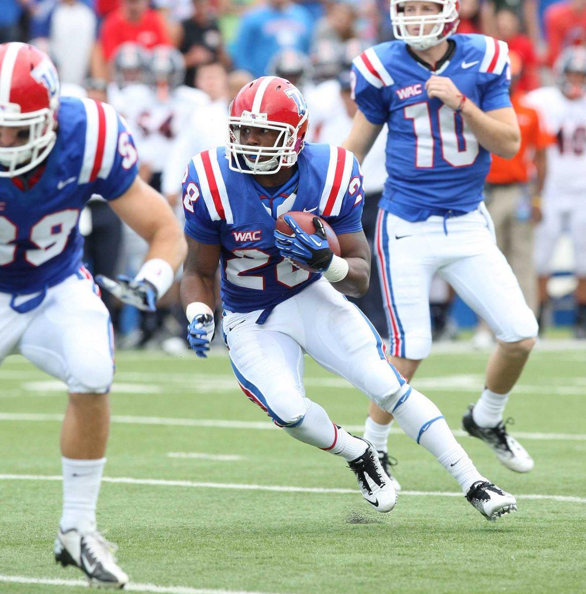 In this Nov. 3, 2012 photo, Louisiana Tech's Kenneth Dixon (28) runs against Texas-San Antonio during an NCAA college football game at Joe Aillet Stadium in Ruston, La. (AP Photo/The El Dorado News-Times, Michael Orrell) MANDATORY CREDIT