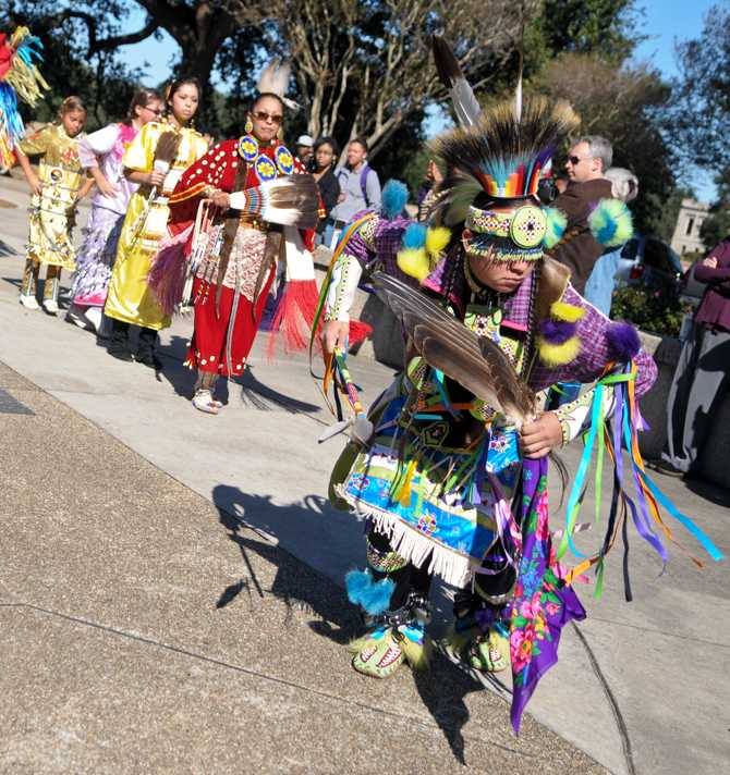 Coushatta tribe member Leland Thompson, right, leads the Grand Entry Wednesday, Nov. 14, 2012, during the Native American Student Association's dance demostration in Free Speech Plaza.
 