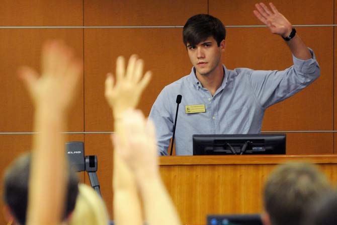 College of Science Senator Trey Schwartzenburg polls the legislative body in the Student union Capital Chamber Wednesday Oct. 24, 2012 on whether they want to change the date for Light the Night from Sunday Nov. 4, 2012 to the following Monday or Tuesday. Some LSU administrators would like to change the date, but some student government senators are wary that it will conflict with Tuesday election day.