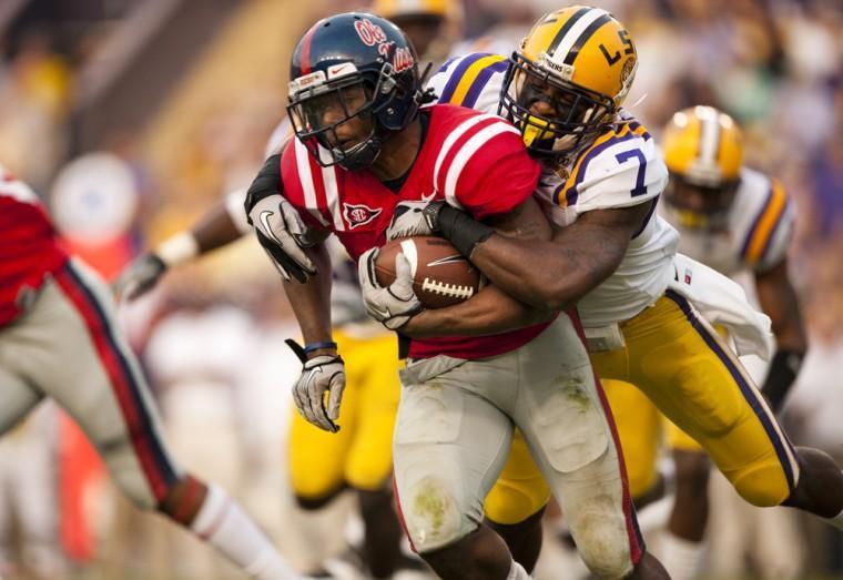 Former LSU cornerback Patrick Peterson takes down an Ole Miss player Nov. 20, 2010, during the Tigers&#8217; 43-36 victory against the Rebels in Tiger Stadium.
 