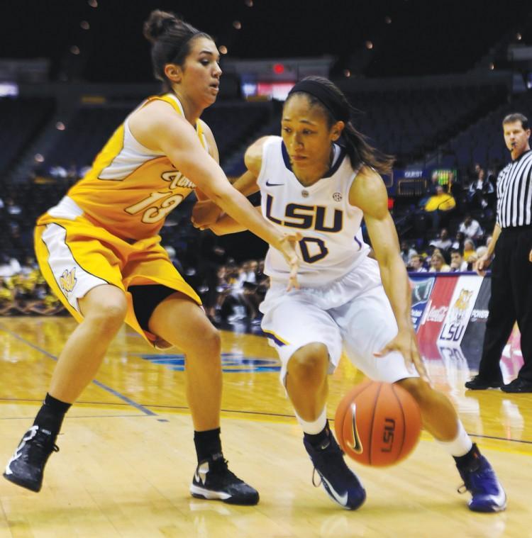 LSU senior guard Adrienne Webb (10) drives past Xavier defenders Thursday, Nov. 1, 2012, during the Tigers' 75-34 victory against the Gold Nuggets at the PMAC.
 