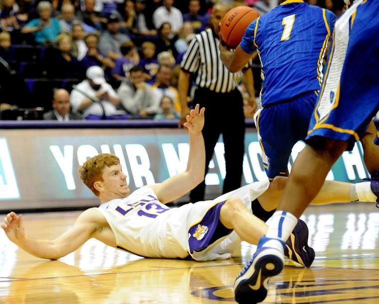 Senior forward Eddie Ludwig falls to the ground Friday, Nov. 9, 2012 during the Tigers' 77-63 win against UC Santa Barbara in the PMAC.
 