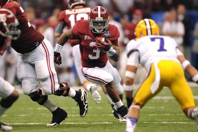 Former Alabama running back Trent Richardson (3) runs up the center during LSU's 21-0 loss to the Crimson Tide in the Allstate BCS National Championship game Jan. 9, 2011.
 